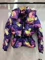 Detail of colorful winter ski jacket featuring vibrant knit pattern and black waist belt - XS / Colorful