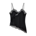 Detailed view of black satin camisole featuring delicate eyelash lace trim and irregular hem - Black