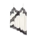 Macro shot of pearl white camisole with black eyelash lace trim and asymmetric hem detail - Black and White Patchwork