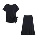 Detailed view of the soft black knit midi skirt with an elegant side knot and A-line cut - Black Zirconia Set