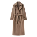 Detail view of camel wool coat with classic lapels, epaulettes, and belted waist design - Camel