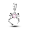 Sterling silver bow charm with heart-shaped pink crystal and beaded bail detail - Ktc1001