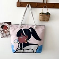 Pink canvas tote bag with anime girl print and white rope handles in a lifestyle setting - Style 38 / One Size