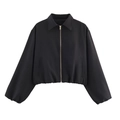 Women's black cropped puffer jacket with gold zipper and elastic cuffs on white background - Black