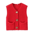 Detail of red cable knit vest featuring gold metallic buttons and V-neckline texture - Red