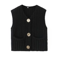 Detail of black knit vest featuring V-neckline and decorative gold embossed buttons - Black