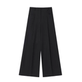 Vue détaillée d'un pantalon noir taille haute avec plis profonds et coupe large - XS / Bas / Noir