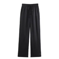 Detail of black wide-leg pants with vertical ribbed texture and elastic drawstring waist - Black Pants