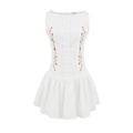 Detail view of floral embroidery and cloth-covered buttons on a white cotton dress - XS / White