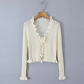 White knit cardigan with ruffle trim, V-neckline, and delicate front tie closure - One Size / Apricot