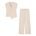 Détail du gilet beige sans manches avec ourlet asymétrique et pantalon large taille haute - S / Haut Et Bas / Milky blanc