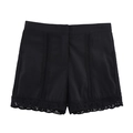 Detail of high-waisted black shorts with lace crochet trim and vertical cutout stripes - XS / Shorts / Black