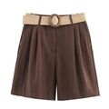 Detail view of high-waist brown Bermuda shorts featuring front pleats and woven belt - Brown