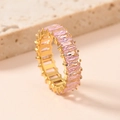 Macro view of gold eternity ring featuring channel-set pink emerald-cut cubic zirconia - US 7 / Pink Zirconia