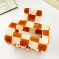 Brown and cream checkered medium hair claw clip with a glossy resin finish and metal spring - Medium Square Hollow Checkerboard Style / Small Orange Blocks