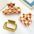 Three-piece hair claw set with orange checkerboard and matte mustard yellow styles - Orange and Yellow Series Hair Clip Set