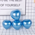 Deep metallic blue heart-shaped latex balloons arranged in a pyramid for wedding decor - Metal Heart / Blue