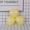 Three pieces of heart-shaped pastel yellow latex balloons for romantic party decorations - Macaron Heart / Yellow