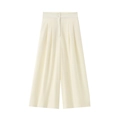 Detail view of high-waist ivory wide-leg trousers with double-button and pleated design - Cream White Wide Leg Pants