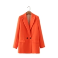 Detail view of double-breasted orange blazer with notched lapel and flap pockets - Orange Red