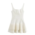 Detail of white sleeveless dress showing square neckline and layered pleated skirt design - White