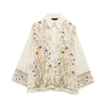 Detail of floral print shirt featuring warm toned flowers and pearl button closure - S / Cream Floral Shirt