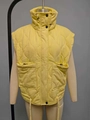 Detail of yellow quilted vest showing diamond pattern, high collar, and cargo pockets - XS / Yellow