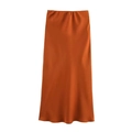 Detailed view of caramel satin high-waisted midi skirt with smooth glossy silk-like texture - XS / Orange