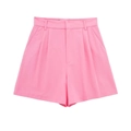 Dettaglio di pantaloncini rosa acceso a vita alta con pieghe e gamba larga chic - XS / Pantaloni e gonne / Rosa