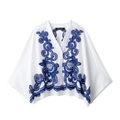 Women's white short sleeve V-neck blouse with blue floral embroidery in a loose fit - XS / Tops