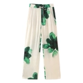 Detail van de wijde bloemenbroek met elastisch trekkoord in de taille en zijzakken - XS / Groene bedrukte broek