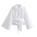 Detail of white wrap poplin shirt featuring a deep V-neckline and waist tie bow detail - XS / White