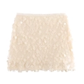 Detailed close-up of glossy cream sequins on a high-waisted chic mini A-line skirt - XS / Milky White