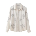 Detailed embroidery of gray palm leaf patterns on off-white long sleeve silk shirt - Apricot Top