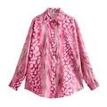 Detail of pink patterned shirt collar with size S label and button-down front closure - Pink Shirt