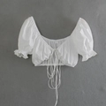Detail of white cropped top with drawstring chest, puff sleeves and ruffled cuffs - S / White