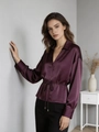 Detailed texture of dark purple satin shirt featuring a V-neck and adjustable waist drawstring - Red