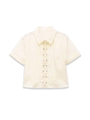 Detail of ruffled trim and metal snap buttons on cream short sleeve shirt - S / Off White