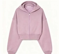 Detail view of pink cropped zip-up hoodie featuring ribbed cuffs and soft fleece fabric - S / Pink Top