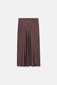 Detailed view of dark brown polka dot satin skirt with soft lustrous fabric texture - Leopard Print