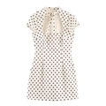 Detail of high neck bow tie and teardrop cutout on cream polka dot mini dress - XS / White Polka Dot