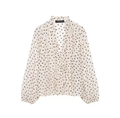 Detailed close-up of chiffon fabric with brown polka dots and ruffled V-neckline - XS / Tops / White Polka Dot