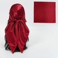 Deep red satin square headscarf with silky glossy finish shown on model and flat layout - Burgundy