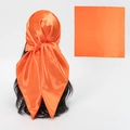 Vibrant orange satin square scarf with a smooth silky finish shown as a headwrap - Orange