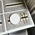 Striped woven place mat with grey and cream fiber patterns and decorative fringe details - Light Gray Striped Woven with Tassels