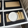 Handwoven placemat in black and beige with fringe edges and natural fiber texture - Beige Woven with Black Tassels