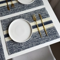 Striped paper rope woven placemat in dark blue and off-white for festive dining decor - Navy Blue Striped Woven