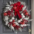 Elegante corona de Navidad con adornos rojos y lazo de terciopelo en puerta oscura - Guirnalda flocada roja / Pequeño