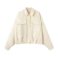 Macro detail of cream cropped bomber jacket showing large utility pockets and metal buttons - S / White