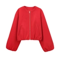 Detail of red vintage bomber jacket showing silver zipper and textured soft fabric - Red
